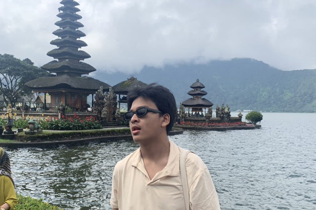 Dhanes by a lakeside temple in Bali